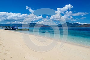 Maumere - An idyllic beach with boats anchored on the shore photo