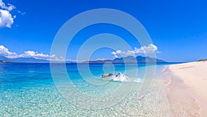 Maumere - A man jumping into the sea photo