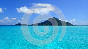 Maupiti island, blue lagoon, volcanic island , green vegetation of bora French Polynesia