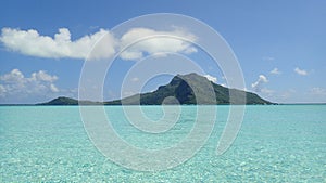 Maupiti island, blue lagoon, volcanic island , green vegetation of bora French Polynesia