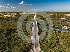 Mauricio Baez Bridge surrounded by greenery on a sunny day in the Dominican Republic photo