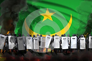 Mauritania police officers in heavy smoke and fire protecting order against mutiny - protest stopping concept, military 3D