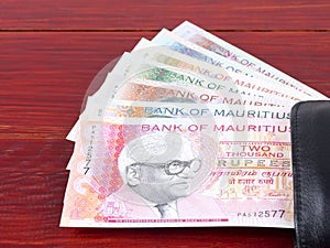 Mauritian Rupee in the black wallet