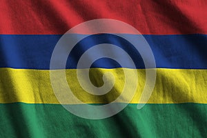 Mauritius flag with big folds waving close up under the studio light indoors. The official symbols and colors in banner