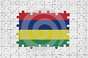 Mauritius flag in frame of white puzzle pieces with missing central part