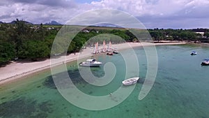 Mauritius island and Albion Beach.  Coastline in Background and People are Playing. Indian Ocean. Yachts in Background