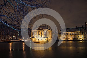 The Mauritshuis seen from de Hofvijver in the Hague at night, covered by snow.