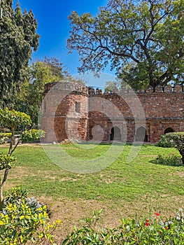 Mausoleum, Sikandar Lodi Tomb, Delhi. Ancient fortress wall, bastion, citadel. Ramparts, battlements, arched recesses. photo