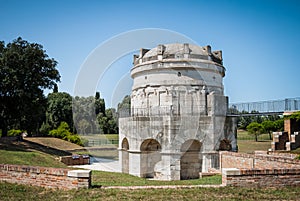 Mausoleum of Theodoric the Great in Ravenna, Italy against clear blue sky and greenery