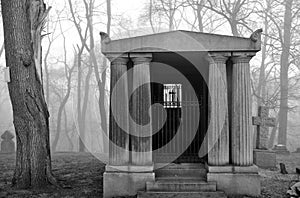 Mausoleum in a very foggy graveyard.