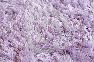 Mauve fluffy carpet texture closeup