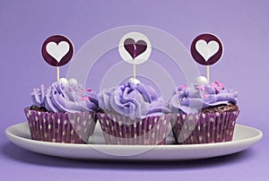Mauve purple decorated cupcakes photo