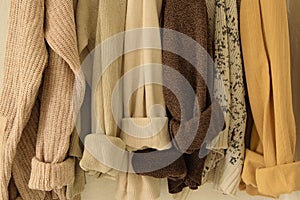 Maxi knitted sweater in warm natural colors. Cozy rustic fashion concept