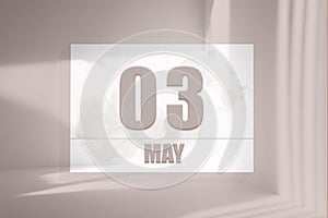 may 03. 03th day of the month, calendar date. White sheet of paper with numbers on minimalistic pink background with