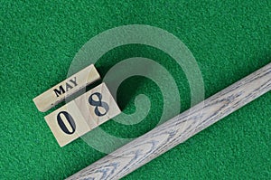 May 08, number cube on snooker table, sport background.
