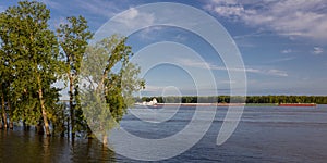 MAY 1, 2019, NEW MADRID, MO., USA - Barge heads North up Mississippi River towards St. Louis as seen from New Madrid, MO