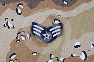 May 12, 2018. US AIR FORCE Senior Airman rank patch on desert camouflage uniform background