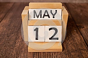 May 12th calendar date text on white wooden