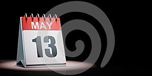 May 13 Calendar Spotlighted on Black Background