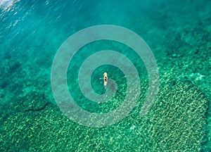 May 15 2016, Haleiwa Hawaii. Aerial view of an unknown Stand up Paddle boarder surfing in the Ocean