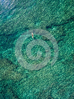 May 15 2016, Haleiwa Hawaii. Aerial view of an unknown Stand up Paddle boarder surfing in the Ocean