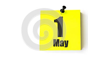 May 1st . Day 1 of month, Calendar date. Yellow sheet of the calendar. Spring month, day of the year concept