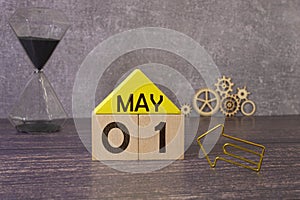 May 1st. Image of may 1 wooden color calendar on white background.