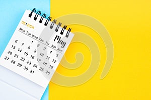 May 2024, Monthly desk calendar for 2024 year on yellow and blue color