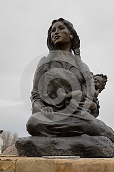 MAY 23, 2019, THREE FORKS, MT, USA - Statue in front of Sacajawea Hotel, Three Forks, Montana honors Sacajawea and the Lewis and