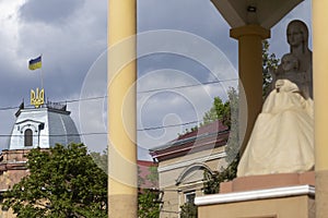 May 25, 2021 Berehove city, Transcarpathia, Ukraine. Ukrainian flag and coat of arms on a house on Tomasz Ese Street in Beregovo,