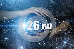 May 26th. Day 26 of month, Calendar date. Human holding in hands earth globe planet with calendar day. Elements of this image