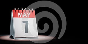 May 7 Calendar Spotlighted on Black Background