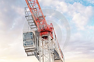Worker in the cockpit of the construction crane