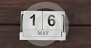 May calendar, change of days. wood calendar with date month and day on a wooden table. fast pace of time during the month. acceler