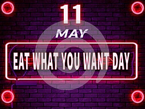 11 May, Eat What You Want Day. Neon Text Effect on Bricks Background