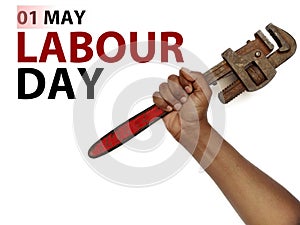 May first International Workers Day. International Workers Day with pipe wrench in hand on Red background