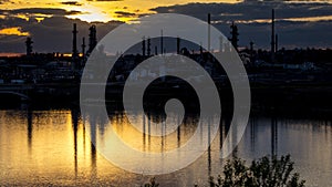 MAY 22, 2019, GREAT FALLS, MONTANA, USA - Sunset on Missouri River and Petroleum Plant, Great Falls, Montana photo