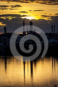 MAY 22, 2019, GREAT FALLS, MONTANA, USA - Sunset on Missouri River and Petroleum Plant, Great Falls, Montana photo