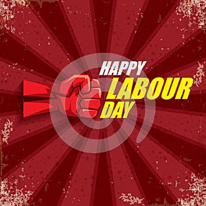 1 may Happy labour day vector label with strong protest fist in the air on bintage red background with rays. vector photo