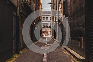 Deserted alleyway next to the busy street of St. Patrick in the heart of the city of Cork in Ireland