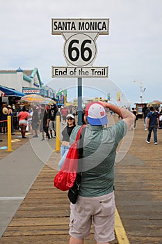 May 14, 2021 Santa Monica California, USA: End of Route 66 Sign on the Santa Monica Pier. Highway Sign that reads the End of the