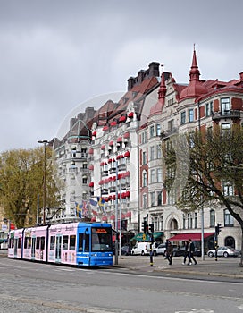 May Sunday walk in the center of Stockholm, a city tram