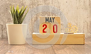 20 May text businrss concept, on wooden block.