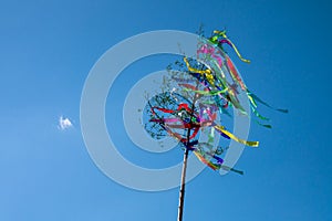 May tree, traditional hungarian austrian german folklore decoration in may with blue sky