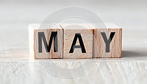 MAY word composed of wooden letters