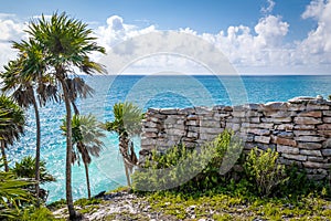 Maya wall ruins, Caribbean sea and Palm Trees - Tulum, Mexico