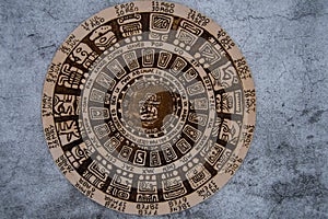 A Mayan calendar on a concrete surface