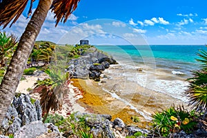 Mayan ruins on top of a cliff and a beautiful beach at Tulum in Mexico