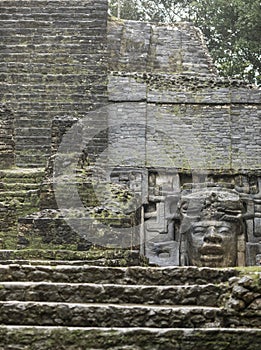 The Mayan temple of Lamanai in Belize, with its Olmec style mask photo