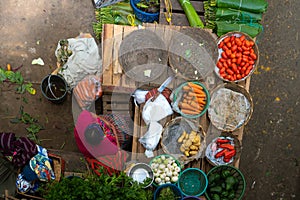 The Mayan woman is waiting to sell her vegetable in the market of Zunil Guatemala.